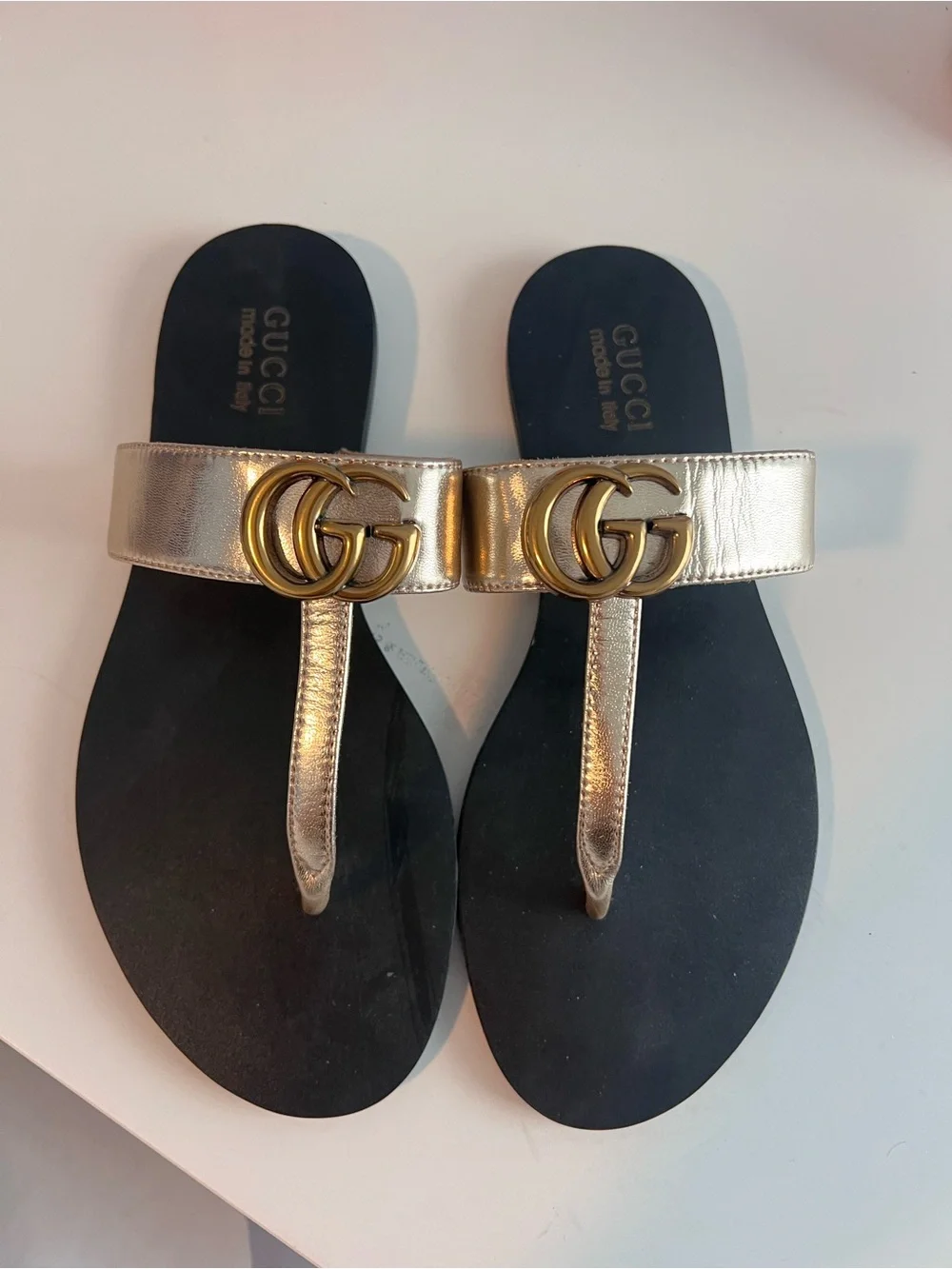 Gucci Metallic Gold Leather GG Thong Sandals with Black Footbed